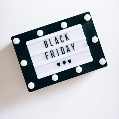 Minimalist Black Friday sign with bulbs, perfect for sales promotions.